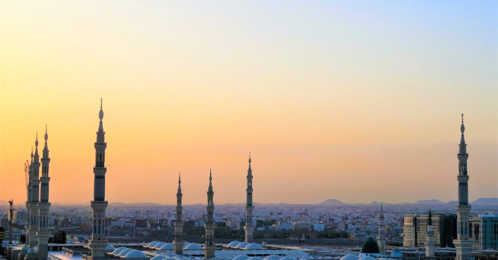 Stunning view of the Prophet's Mosque minarets at sunset in Medina, Saudi Arabia.